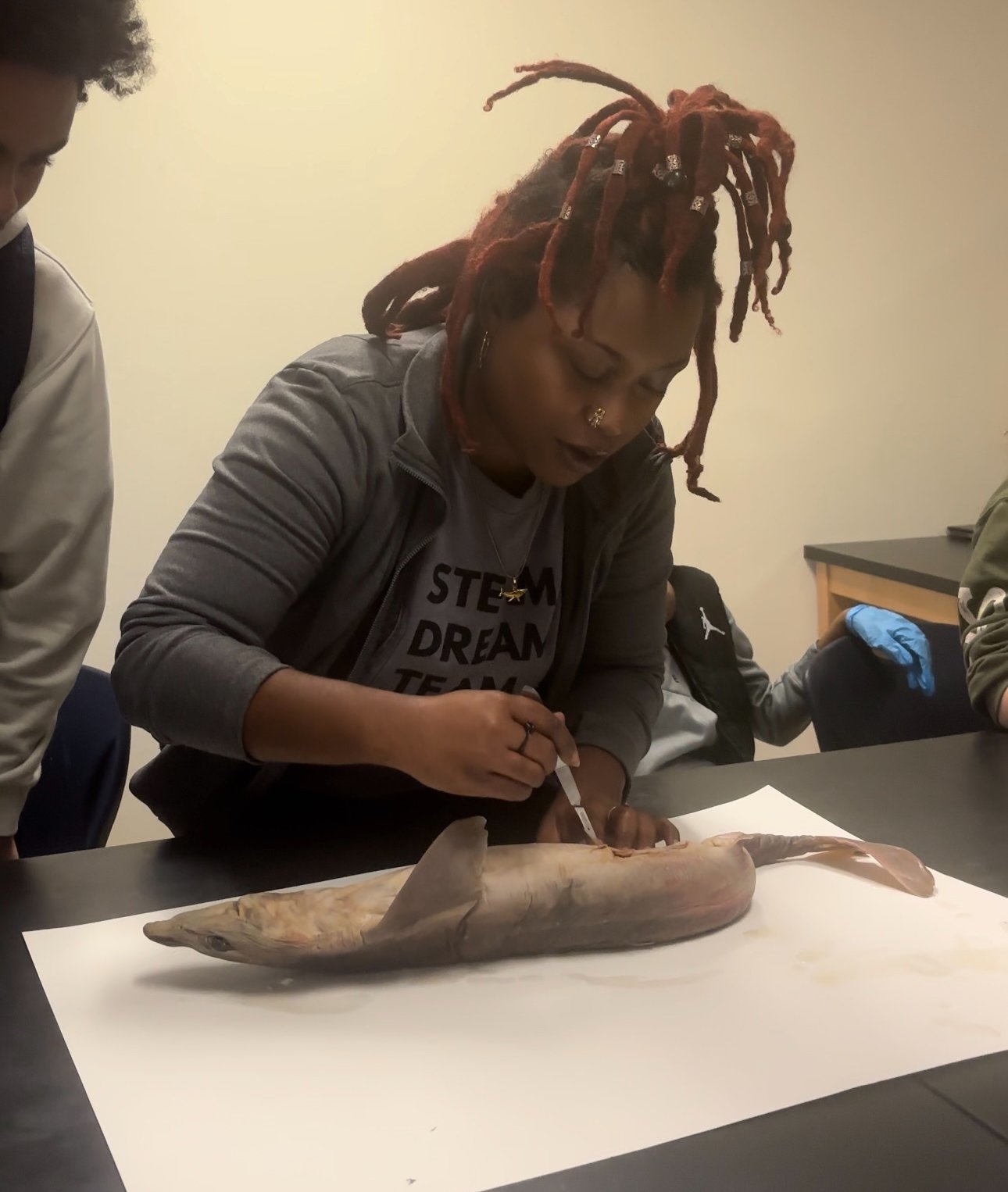 Ms. Sara doing a shark dissection with 7th graders