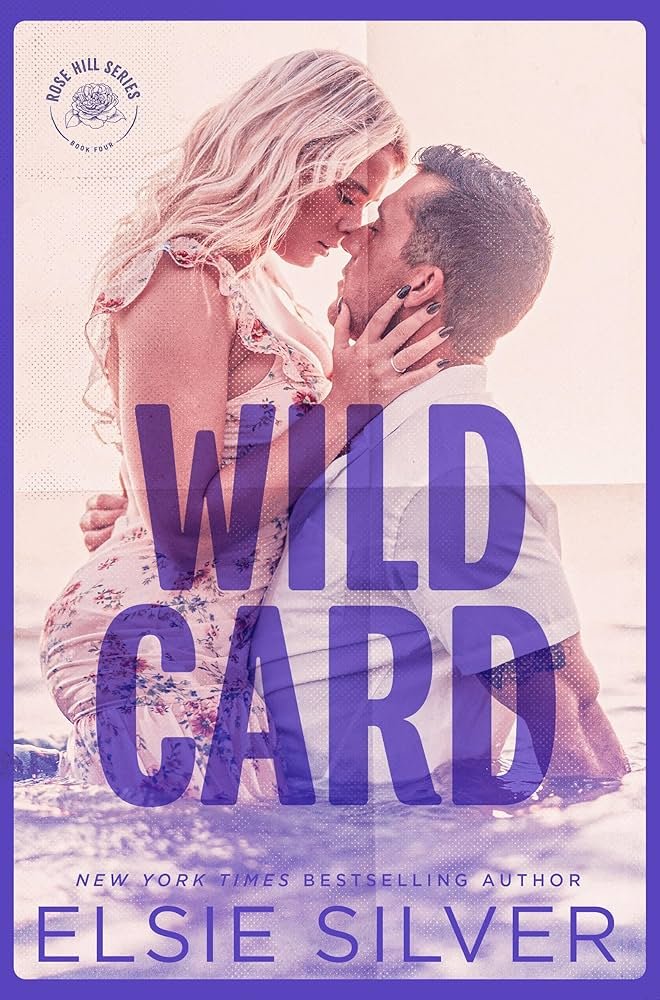 A couple with light and dark skin tones embracing in shallow water, with the woman holding the man's face and the man holding her waist. The background is a beach scene, and the book cover features purple text reading 'WILD CARD' and 'ELISIE SILVER,' with smaller text indicating it is part of the Rose Hill Series by Elsie Silver.