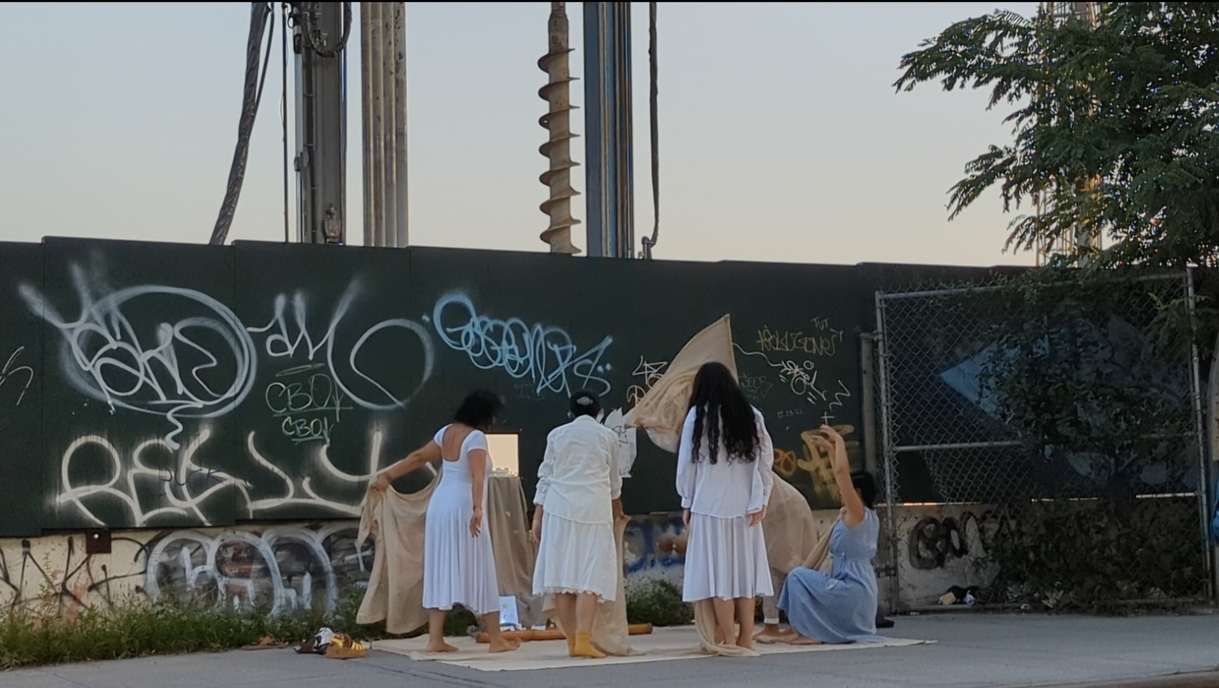 Caption: Karla, with Valeria, Valentina, Sarah, Ligaiya, Kike, and Cecilia, perform Encantación Para El Yonke as part of Remember Y(our) Connection / Tandaan Ang Ating Ugnayan Project: From Here to Our Motherlands, Willets Point, Corona, Queens, NY,