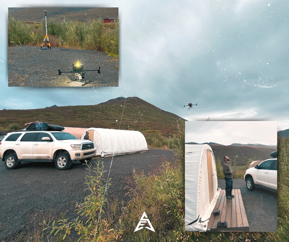 A drone flying in the sky near a mountain, with a camp setup including a vehicle and a tent on gravel ground, and a person standing near the tent.