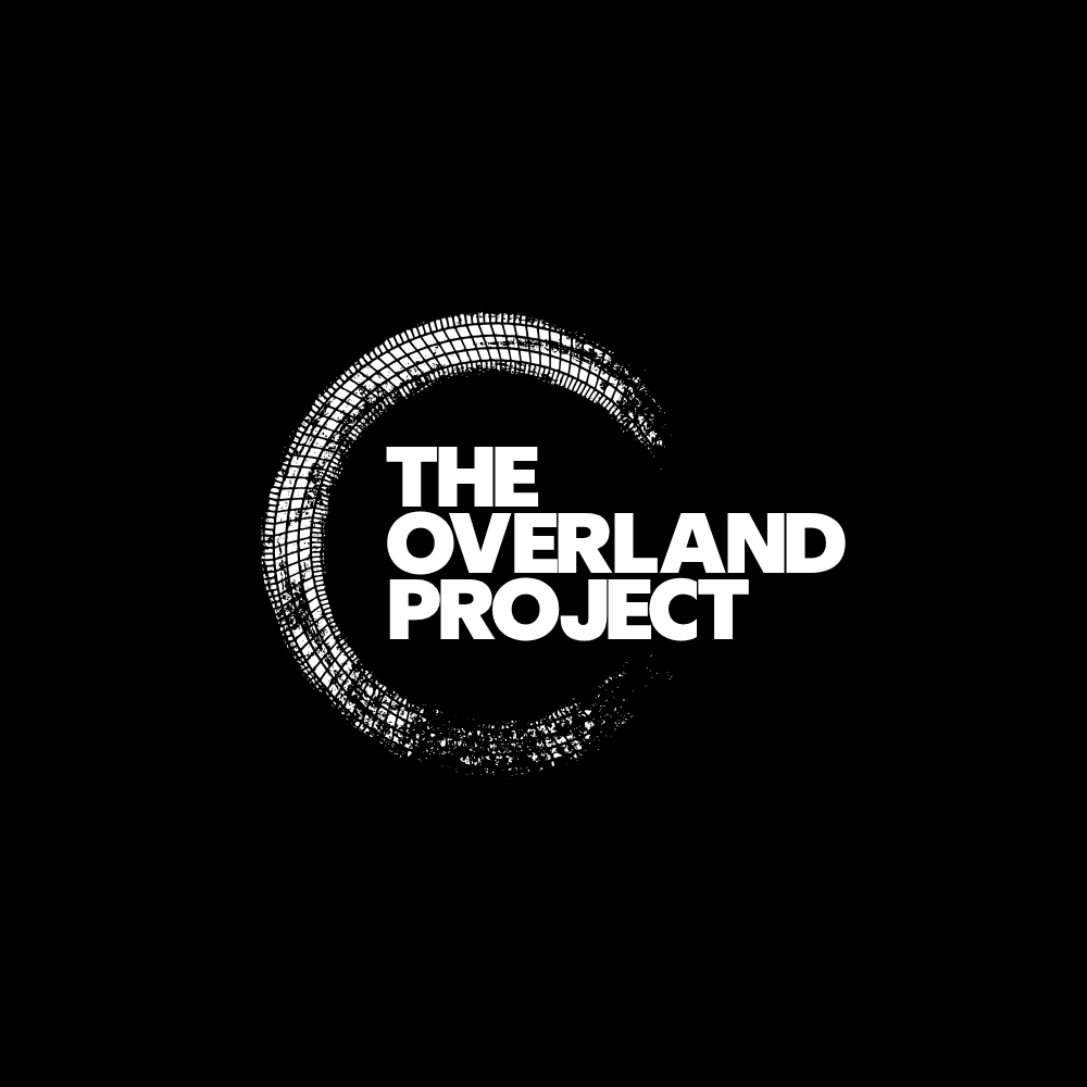 Black and white logo for 'The Overland Project' with a circular graphic design around the text.