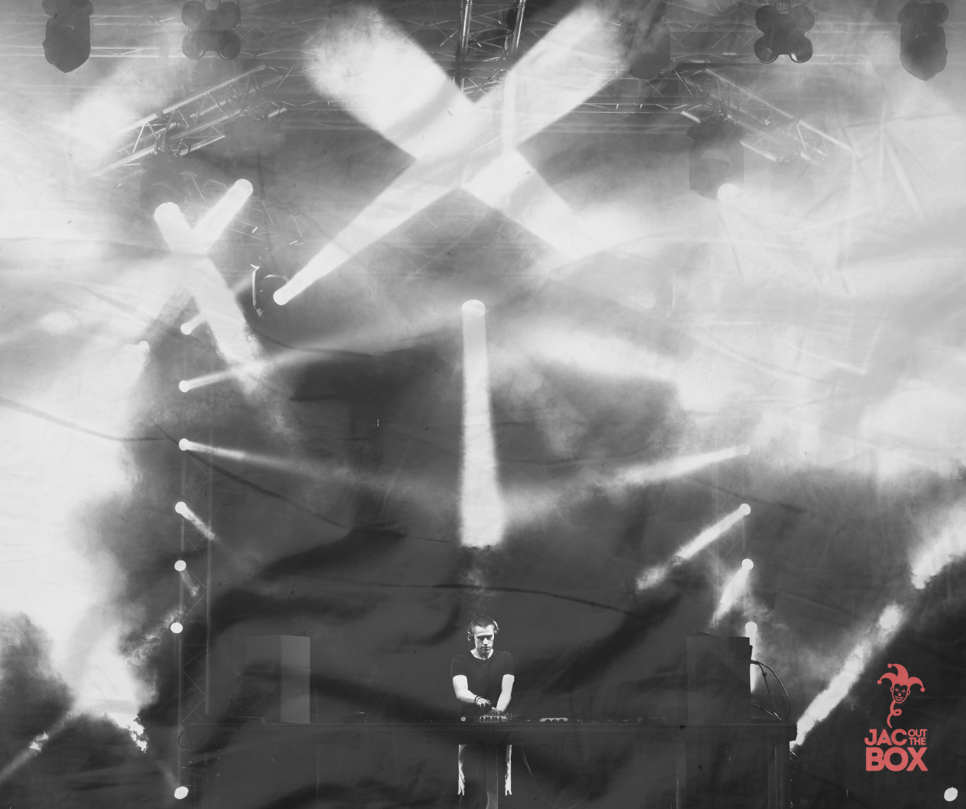 A DJ performs on stage with lighting effects and smoke, with a logo reading 'JAC OUT THE BOX' in the corner.