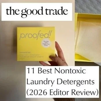 A yellow box labeled 'proofed!' held by a person with a thumb pointing upward, positioned on a white surface with a yellow-covered open box nearby, and overlaid with text reading 'the good trade' and '11 Best Nontoxic Laundry Detergents (2026 Editor 