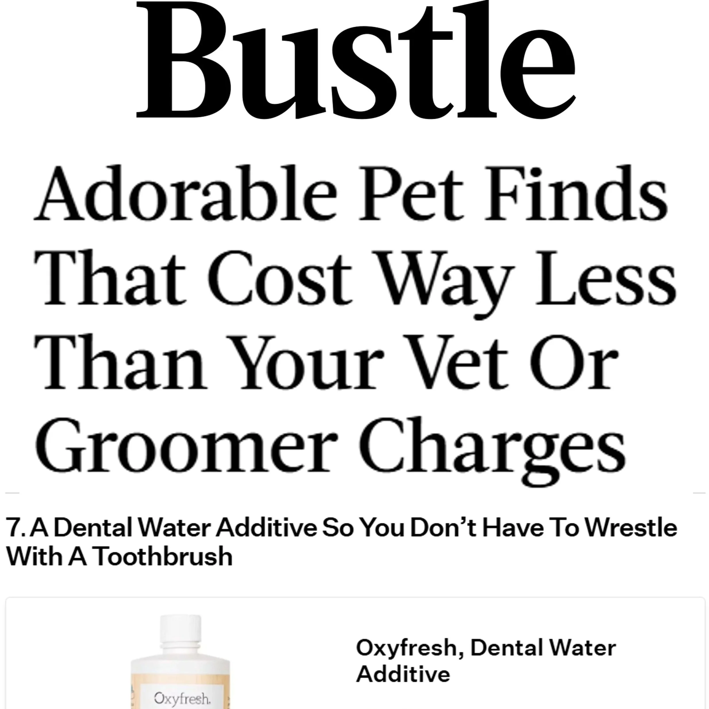 A bottle of Oxyfresh Dental Water Additive with the label visible and a dropper applicator attached.