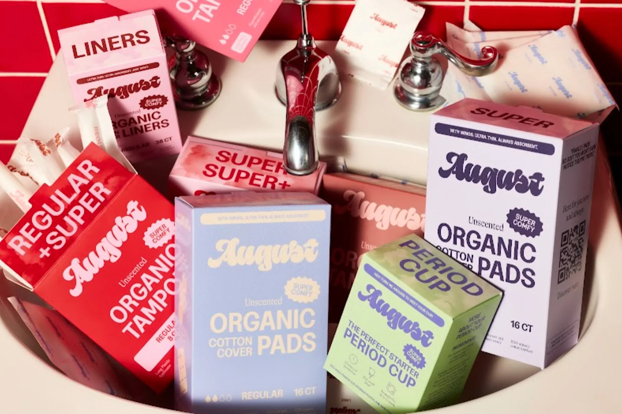 Various boxes of organic Cotton Pads and Organic Tampons on a display shelf.