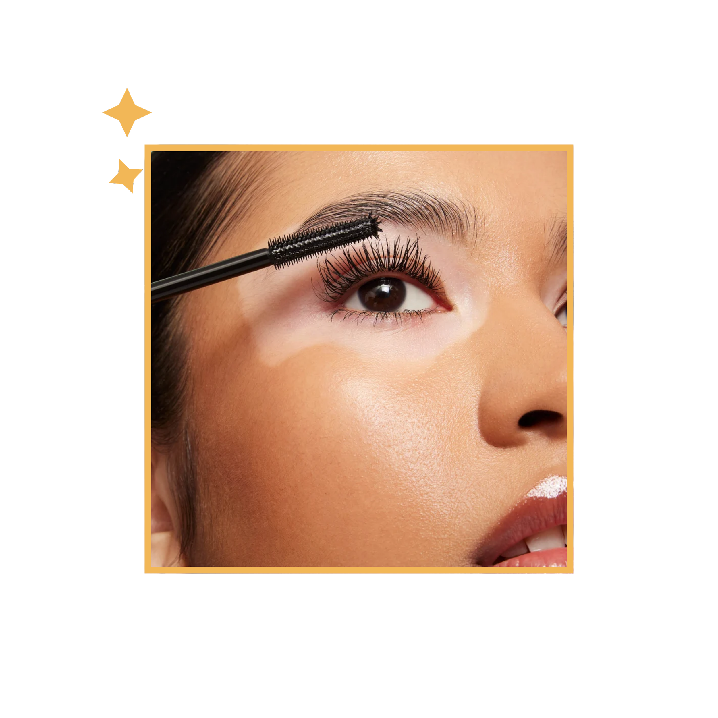 Model applying Kulfi mascara, close-up of the eye.