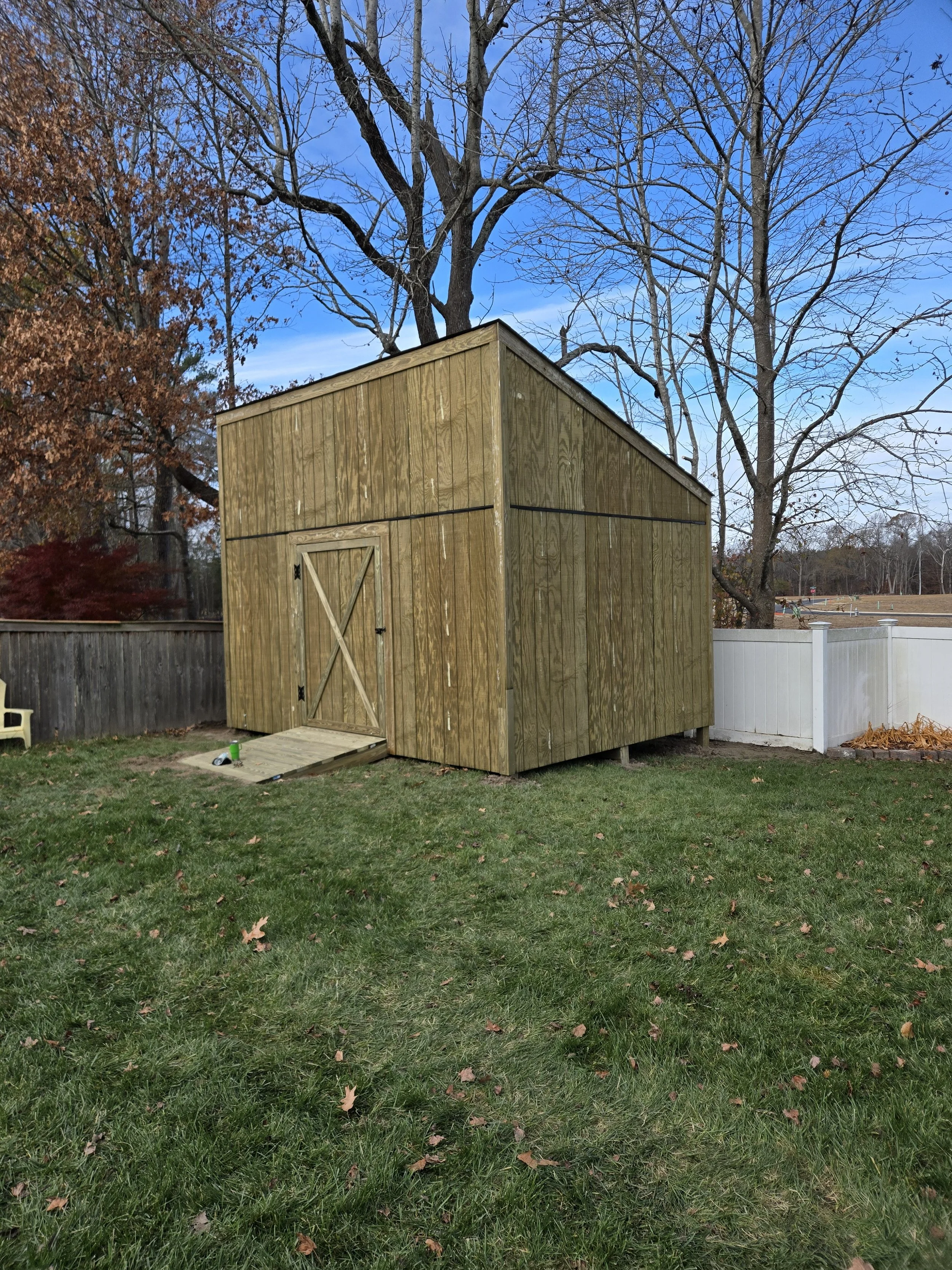 large outdoor shed with ramp
