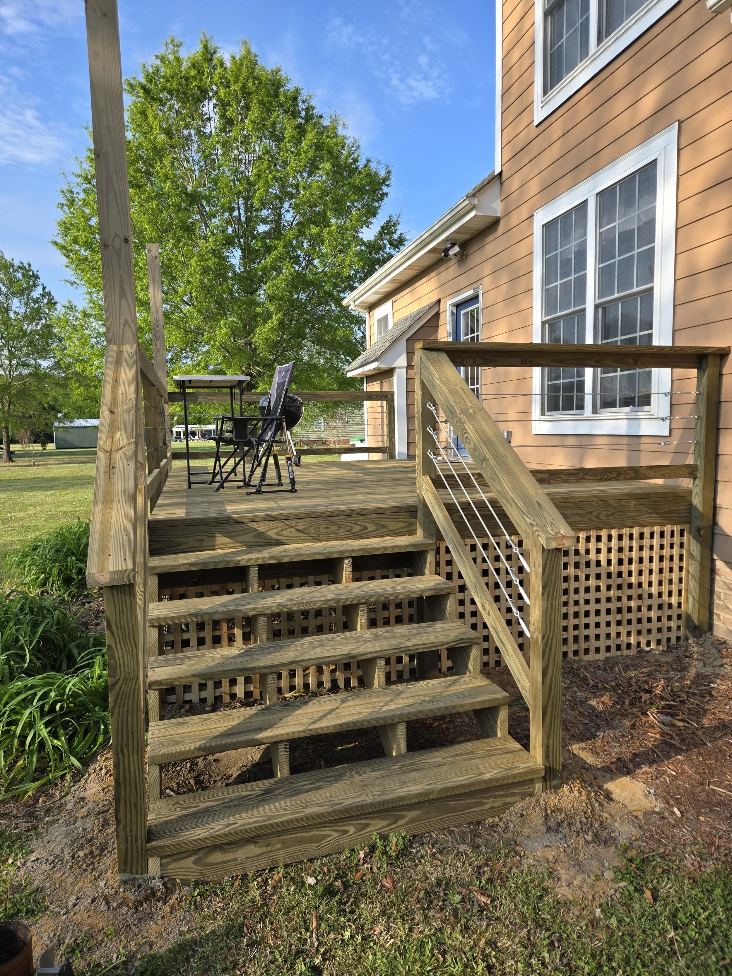 backyard deck with furniture and grill