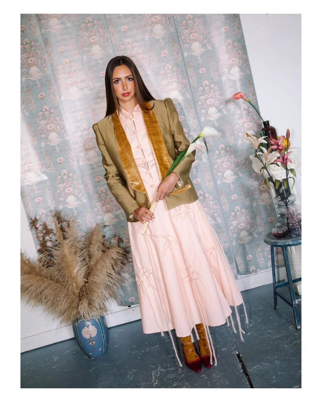 INCA 
Designed and created by: @vivianaastraniero 

This look features an eclectic mix of textures and proportions, centered around a soft peach skirt and top set. The top showcases a fold-over point Mandarin collar and delicate knotted toggle closur