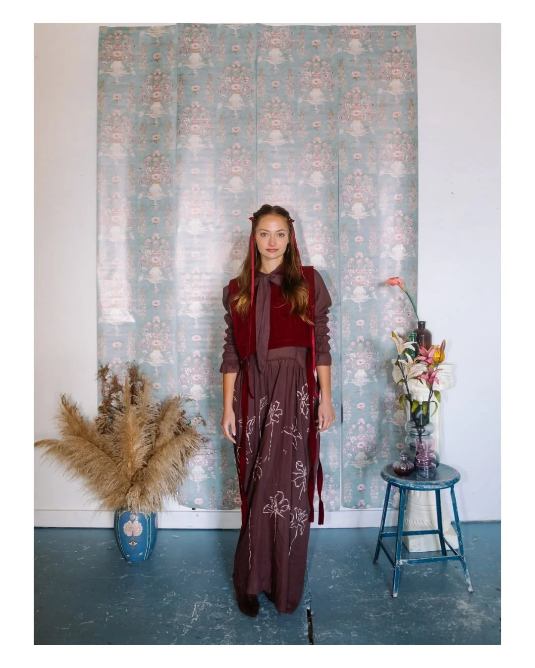 MAPIRA
Designed and created by: @vivianaastraniero 

This look centers on a deep cocoa-toned maxi dress, featuring a silhouette that balances romantic volume with technical precision. The fabric was treated with sustainable tannins and mordants, prov