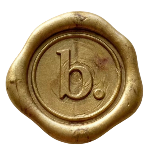 Close-up of a wax seal with the letter 'b.' embossed on it.