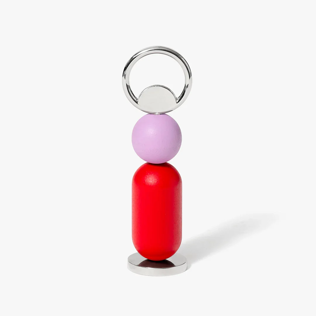 A modern decorative bottle opener - colorful red and purple wooden bead,