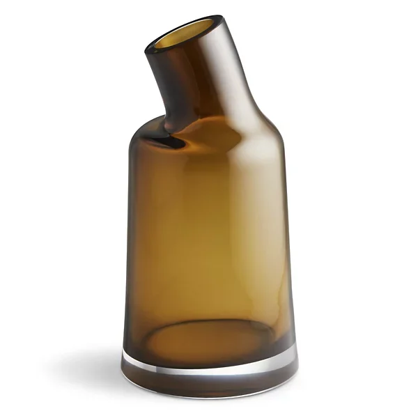 A tilted amber glass vase with a narrow opening against a plain white background.