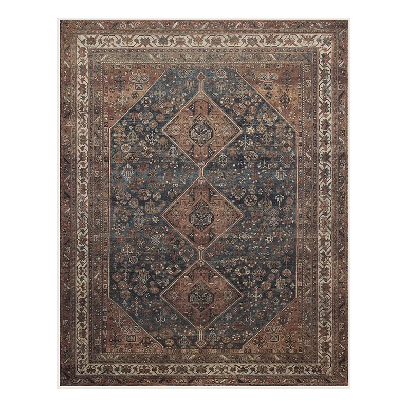 A traditional Persian-style area rug with a central diamond pattern in shades of brown, blue, and beige, surrounded by intricate floral and geometric border designs.