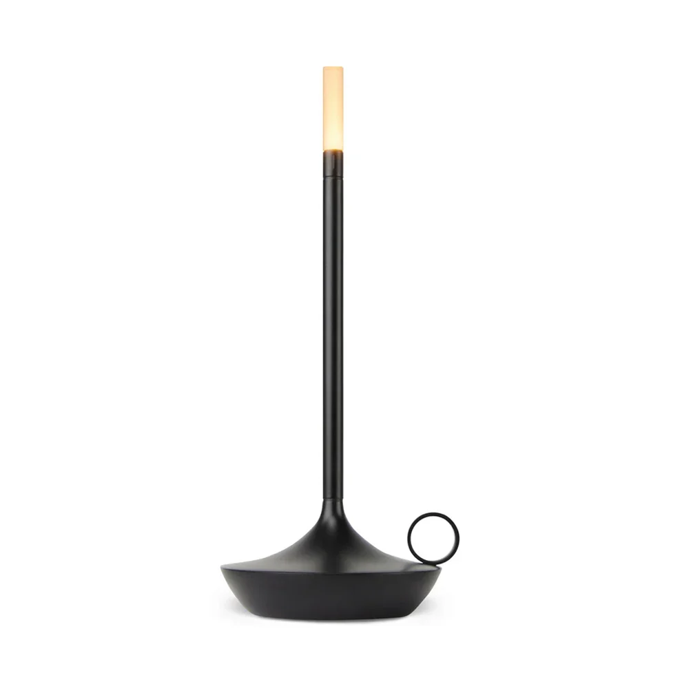 A modern black cordless table lamp with a tall, thin, illuminated light and a circular handle on the side, set against a white background.