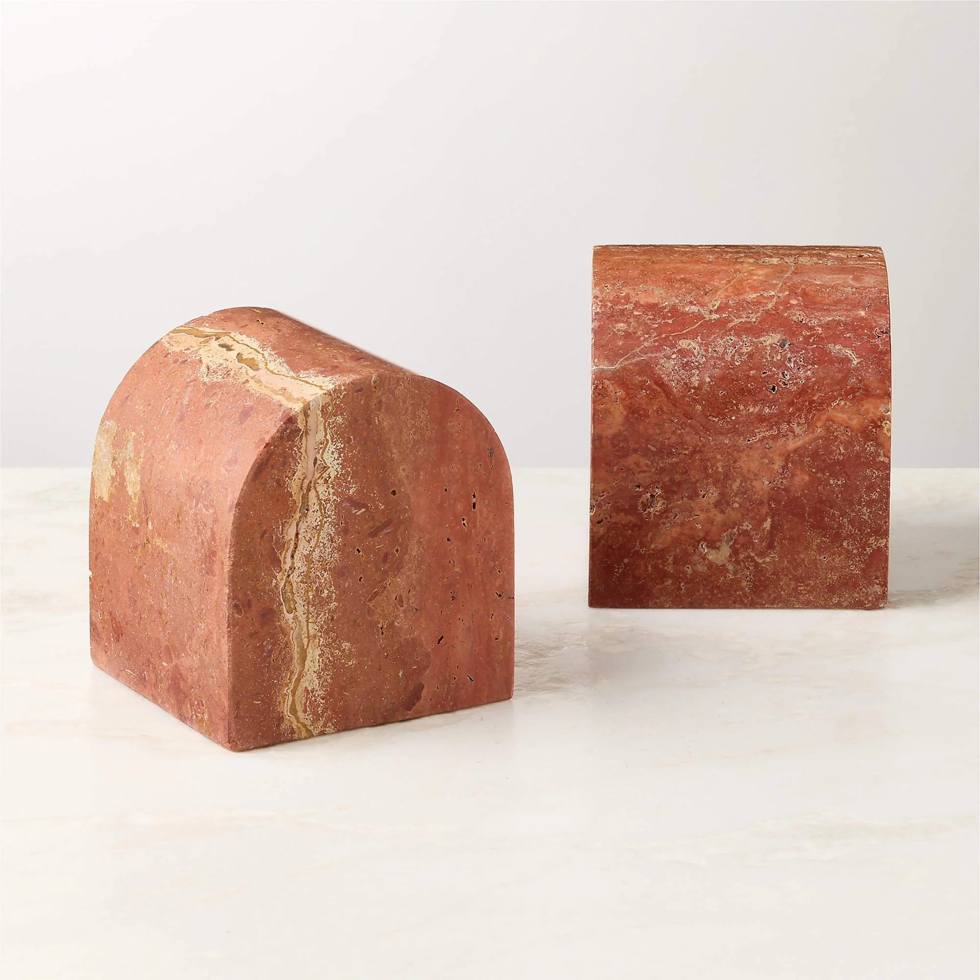 Two pieces of red marble with natural veining and texture bookends