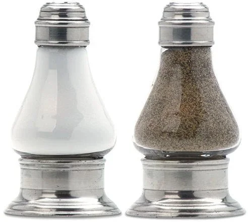 Salt shaker and pepper shaker side by side
