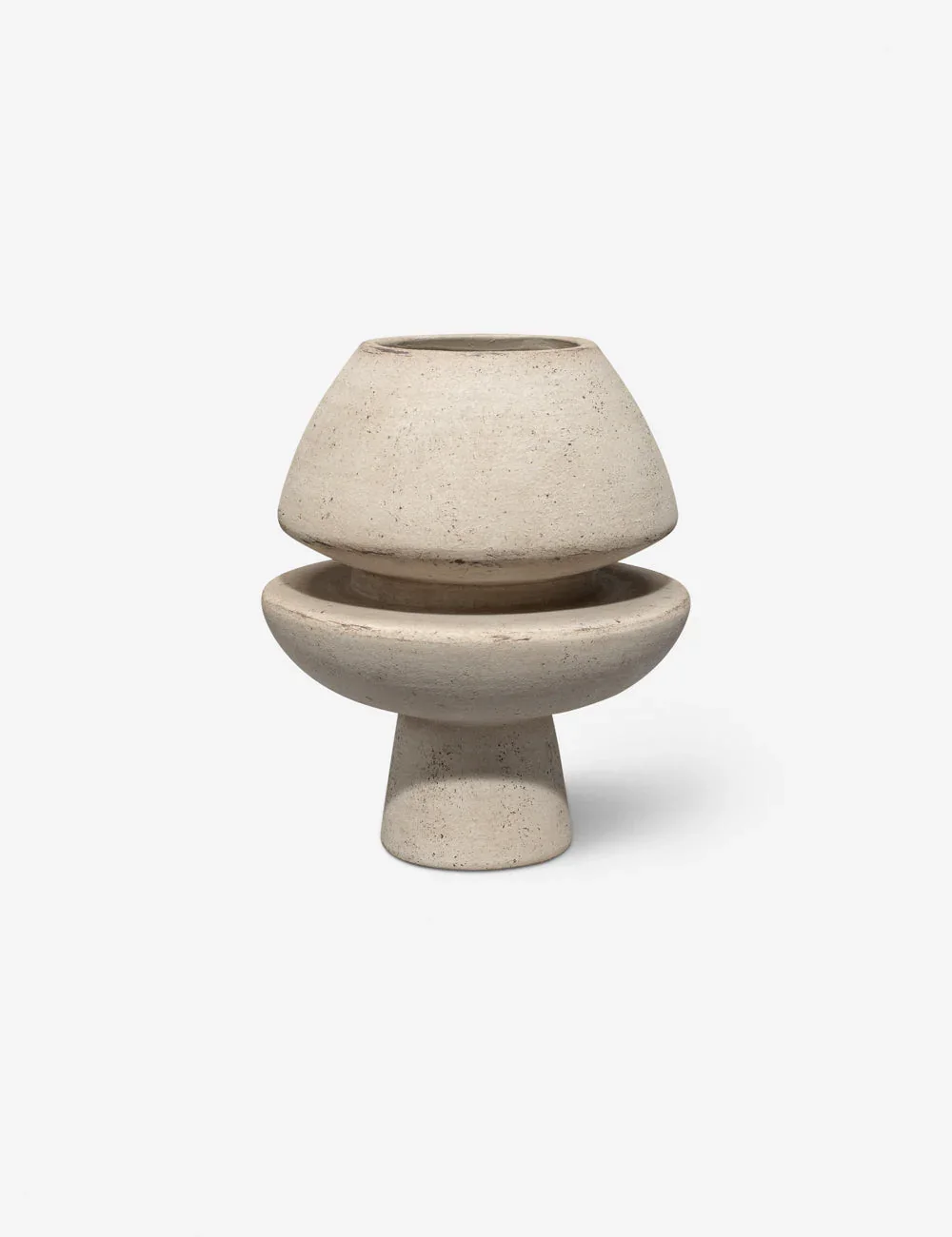 A modern, minimalist ceramic vessel with a tiered, abstract shape, featuring a stack of three segments in a neutral, textured finish. interior decor, vase