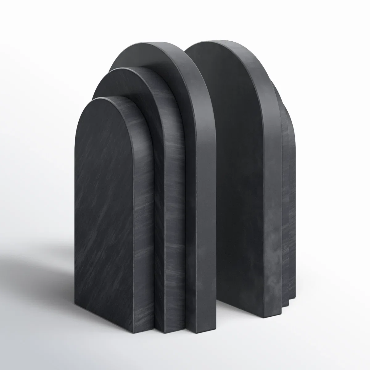 set of bookends - black, arches of varying sizes, made of a smooth, matte material, arranged in descending order