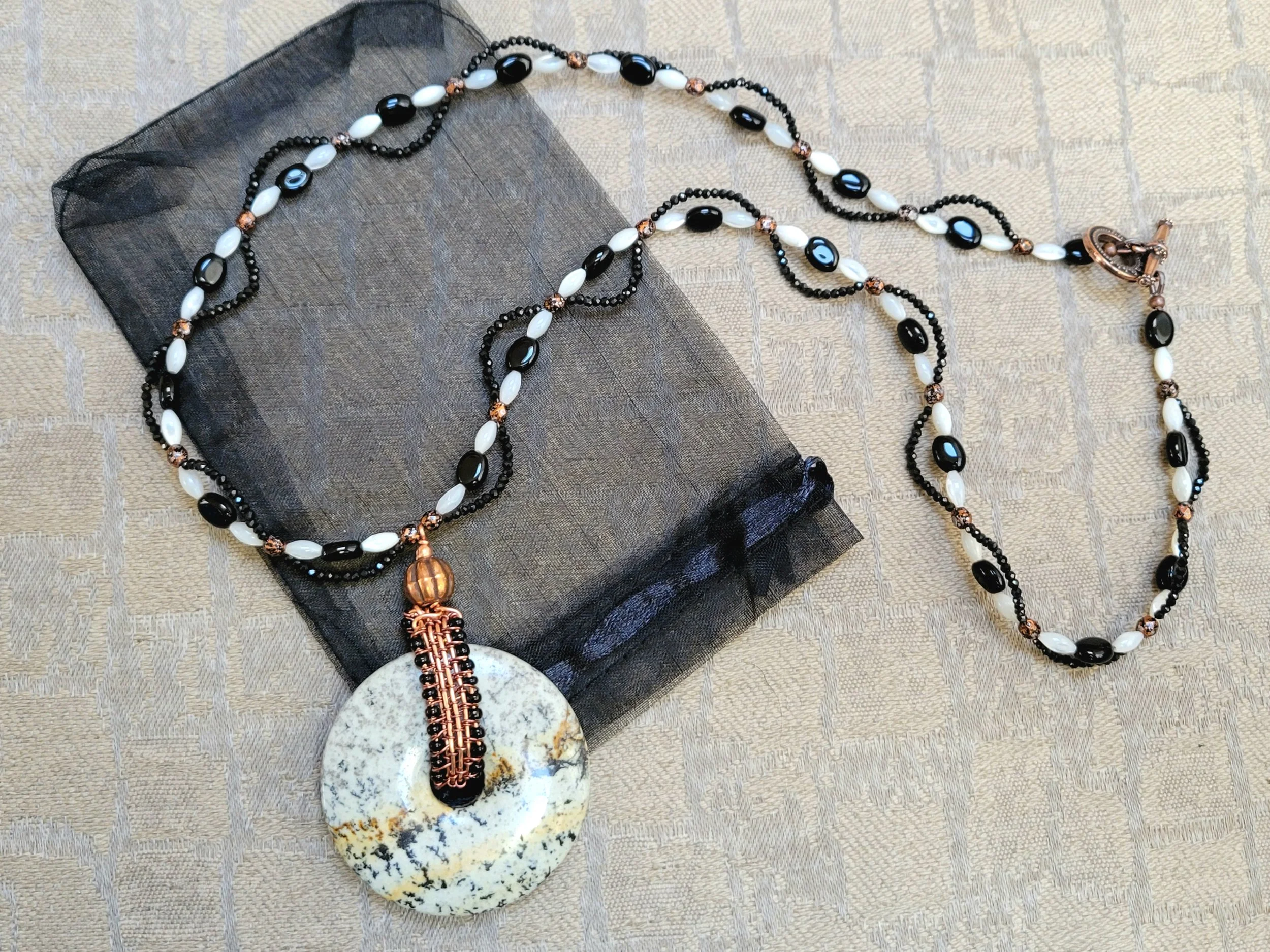 Mother of Pearl, Black Onyx, and Black Spinel Beaded Necklace with Agate Donut Pendant