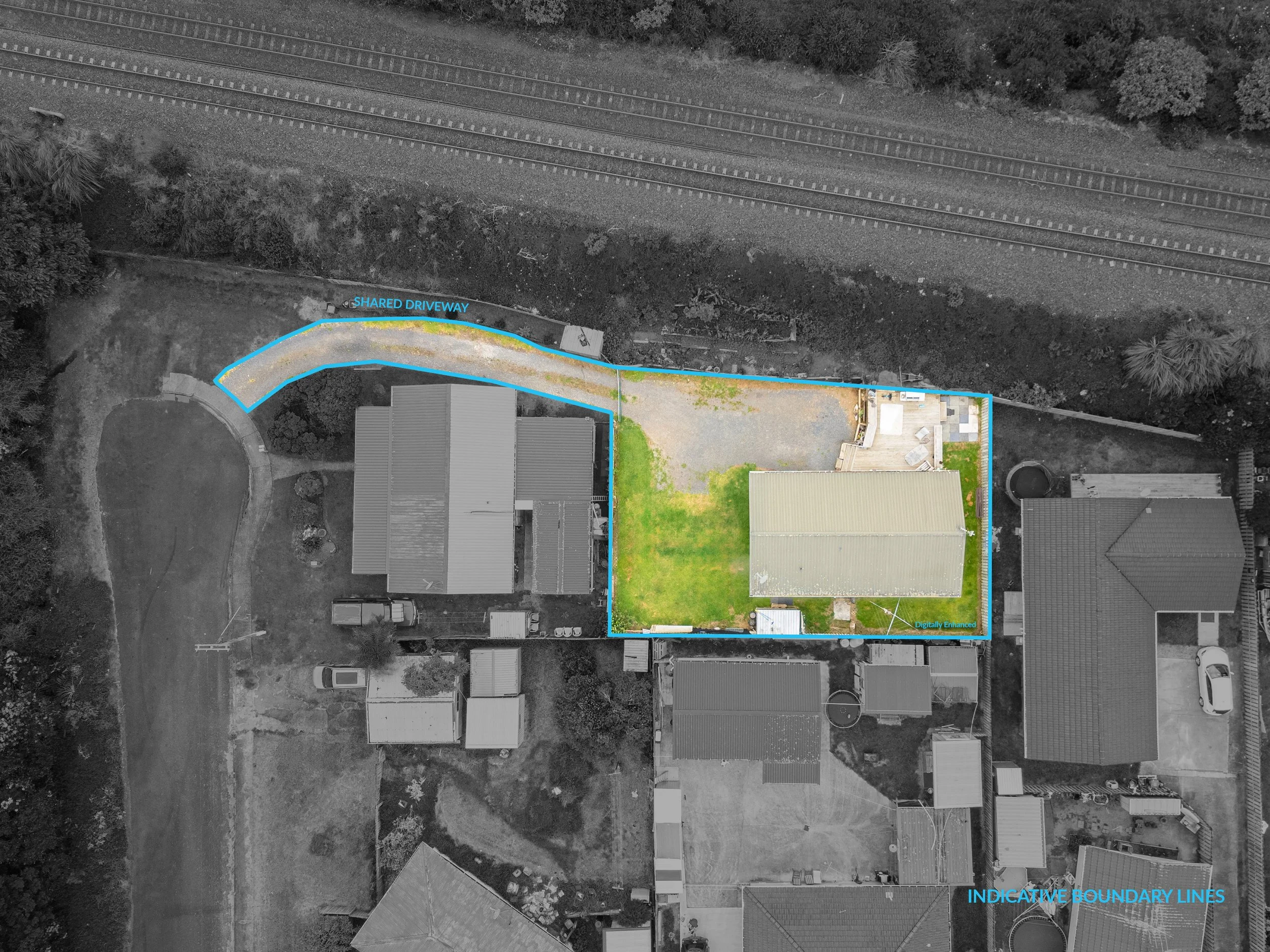 Aerial view of a residential property showing a house and backyard, with how the landscape and boundaries are marked with blue lines labeled 'Shared Driveway' and 'Indicative Boundary Lines'.