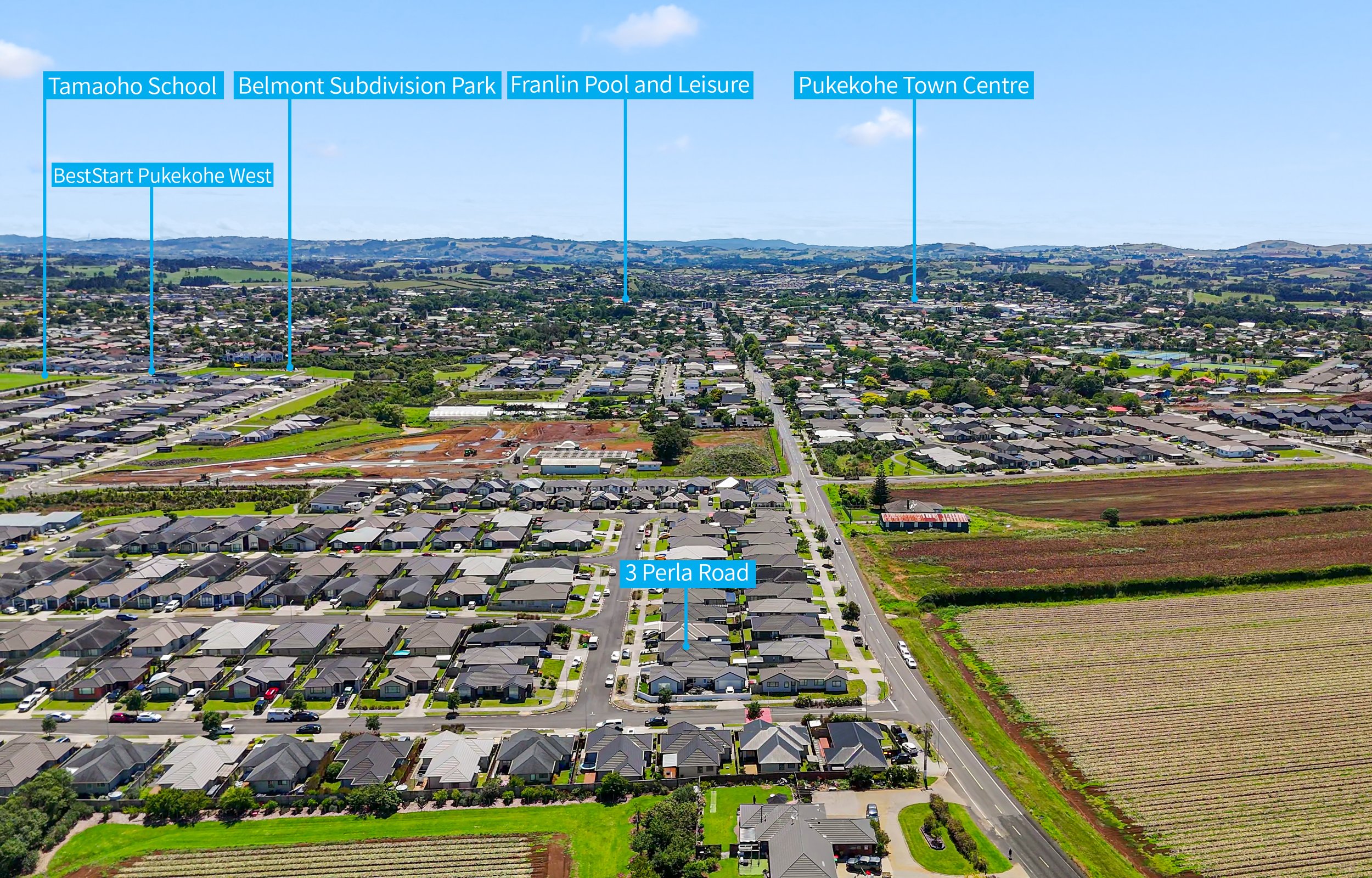 Aerial view of a suburban area with labeled locations including Tamaho School, Belmont Subdivision Park, Franklin Pool and Leisure, Pukekohe Town Centre, BestStart Pukekohe West, and 3 Perla Road, showing residential houses, roads, parks, and fields.