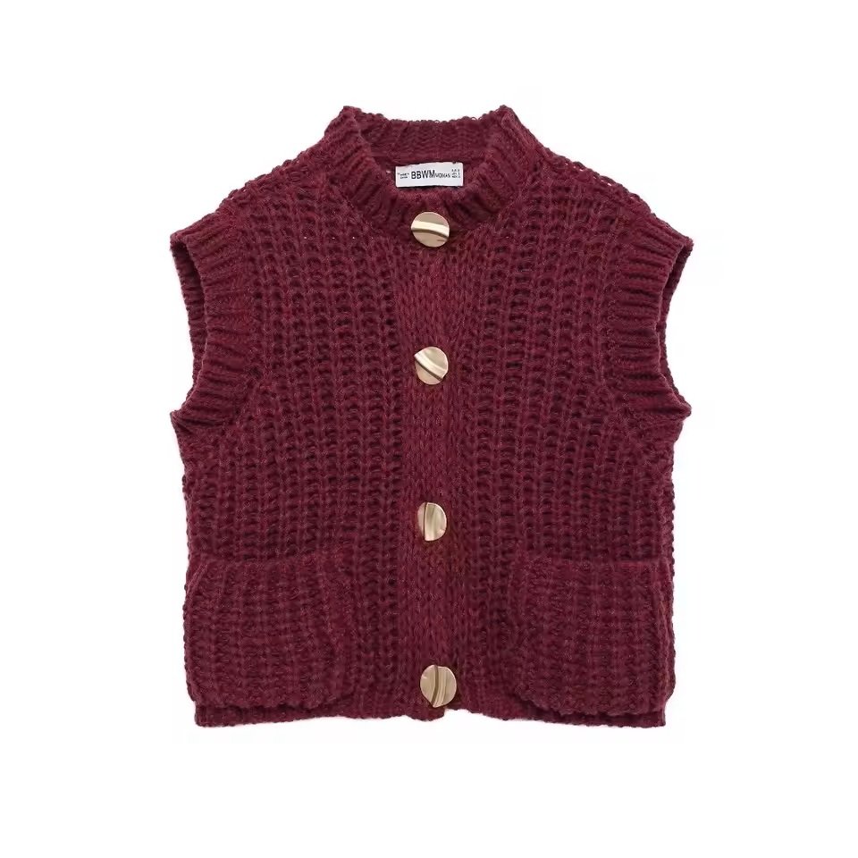 A sleeveless, chunky knit maroon vest with four large, gold buttons down the front.