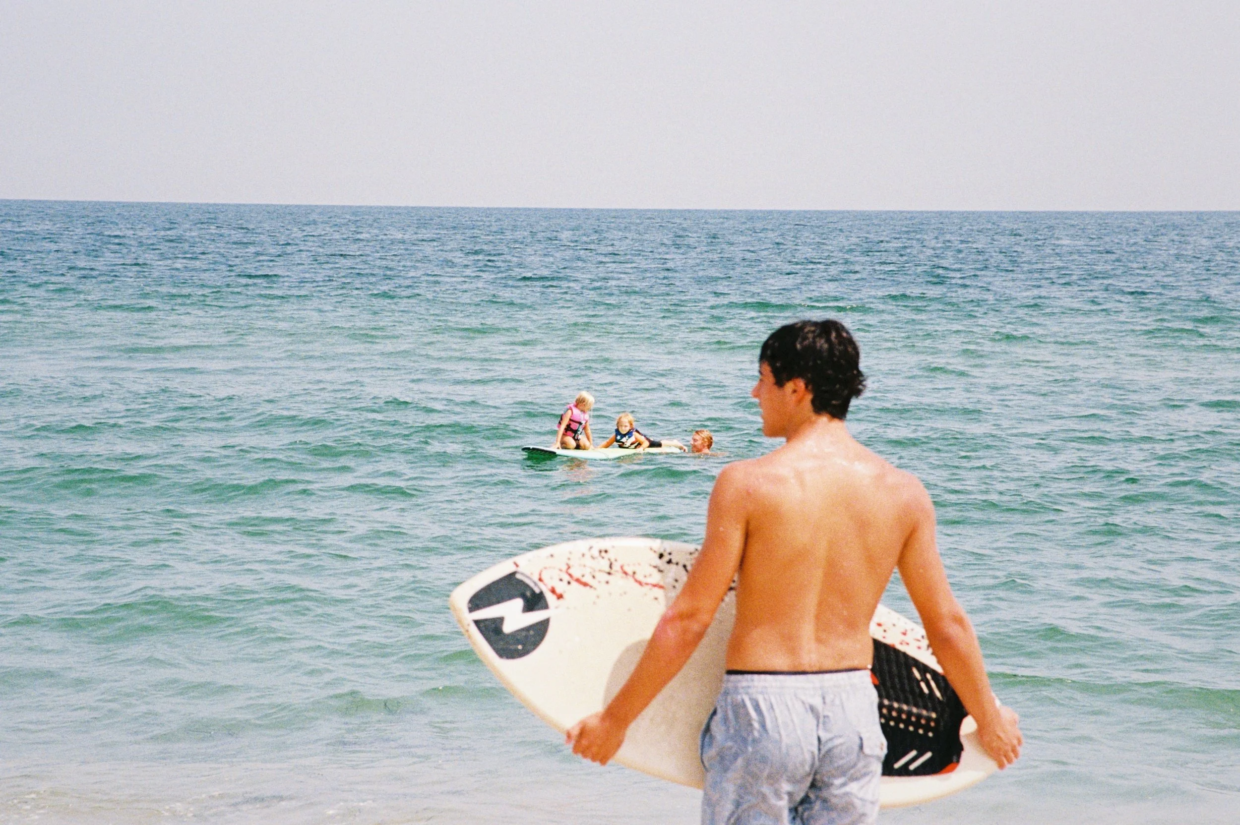 Nolan skimming on an especially dreamy water day in Harvey Cedars.