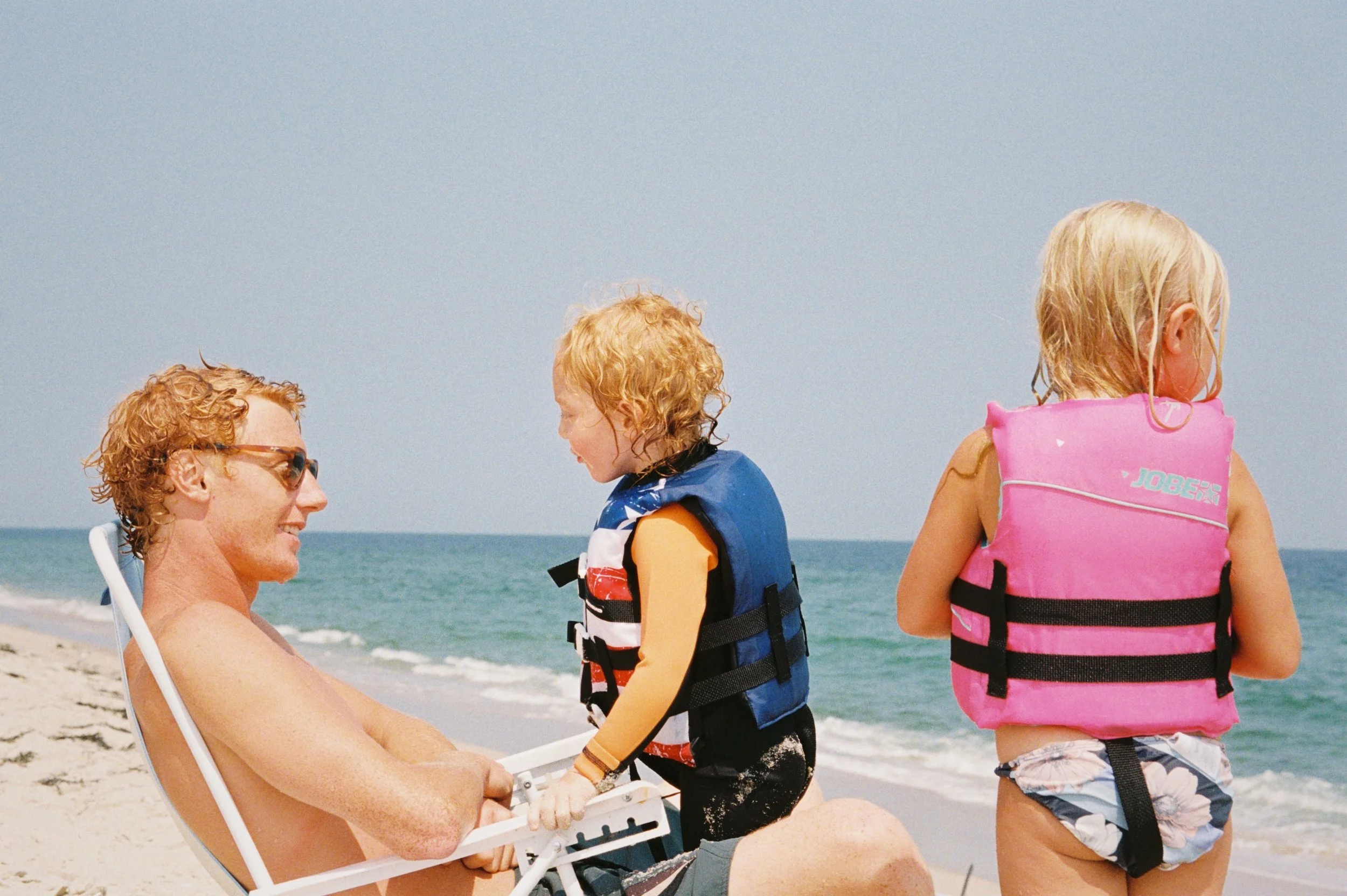 George with his niece and nephew enjoying the peak of summer in Harvey Cedars, New Jersey.