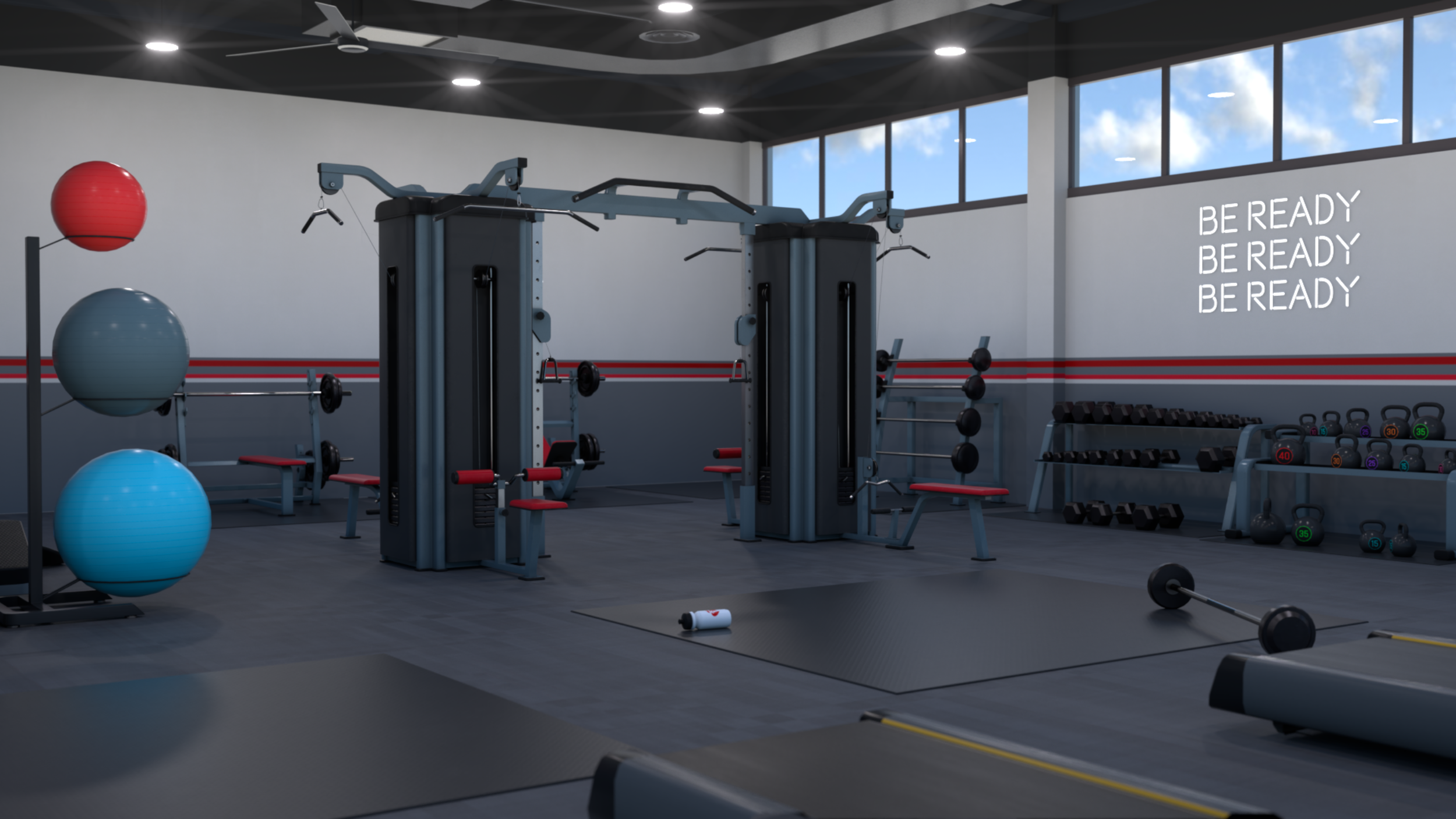 Modern gym interior with weightlifting equipment, stability balls, dumbbells, and motivational sign on wall that reads 'BE READY' multiple times, illuminated by ceiling lights and natural light from large windows.