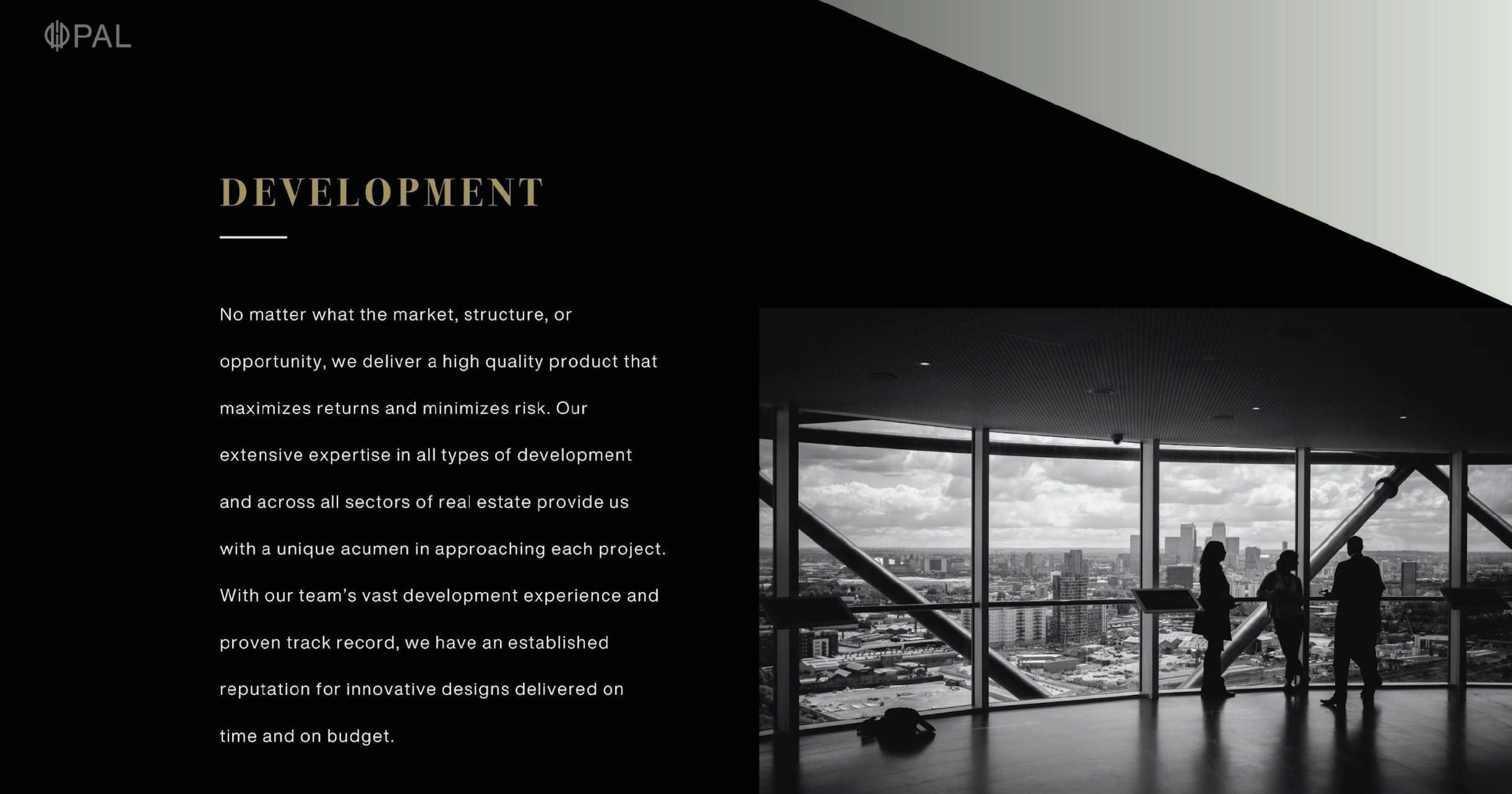 A website homepage for a real estate development company featuring a black and white photo of people inside a modern building with large windows and a city view, and a text section about the company's development expertise.