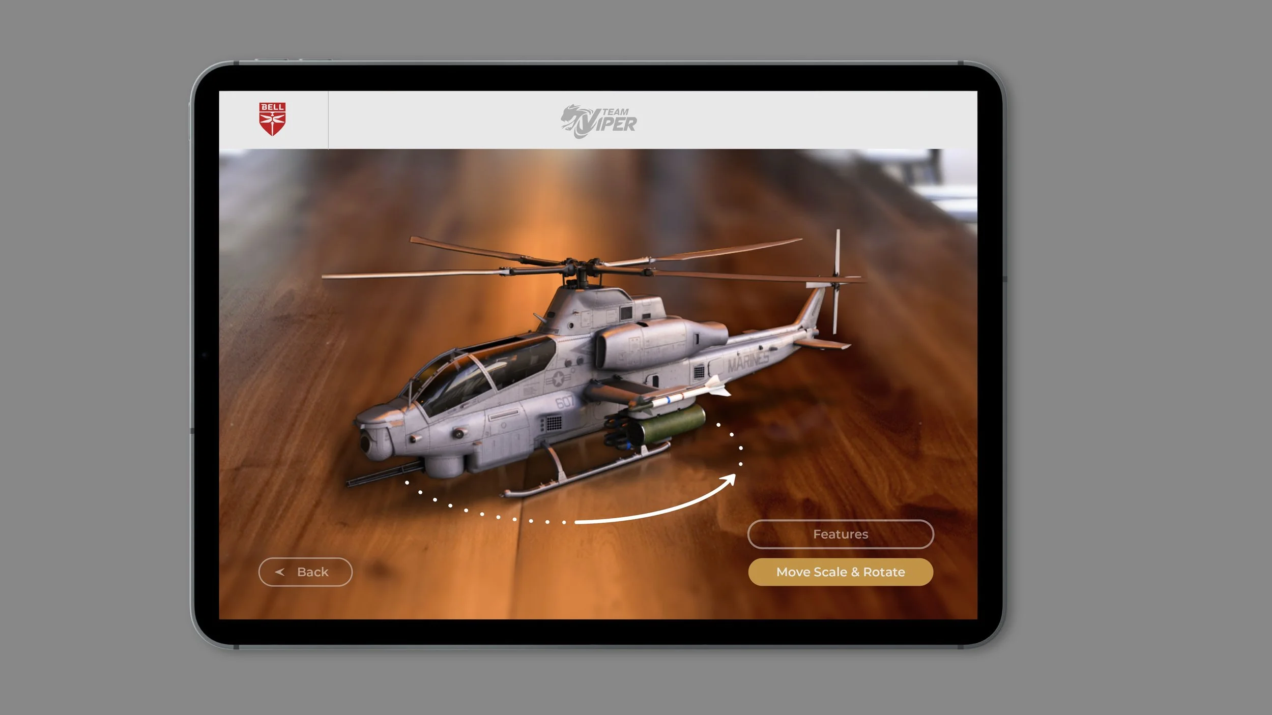 A digital image of a helicopter model on a mobile device screen, with options to move, scale, and rotate the model.