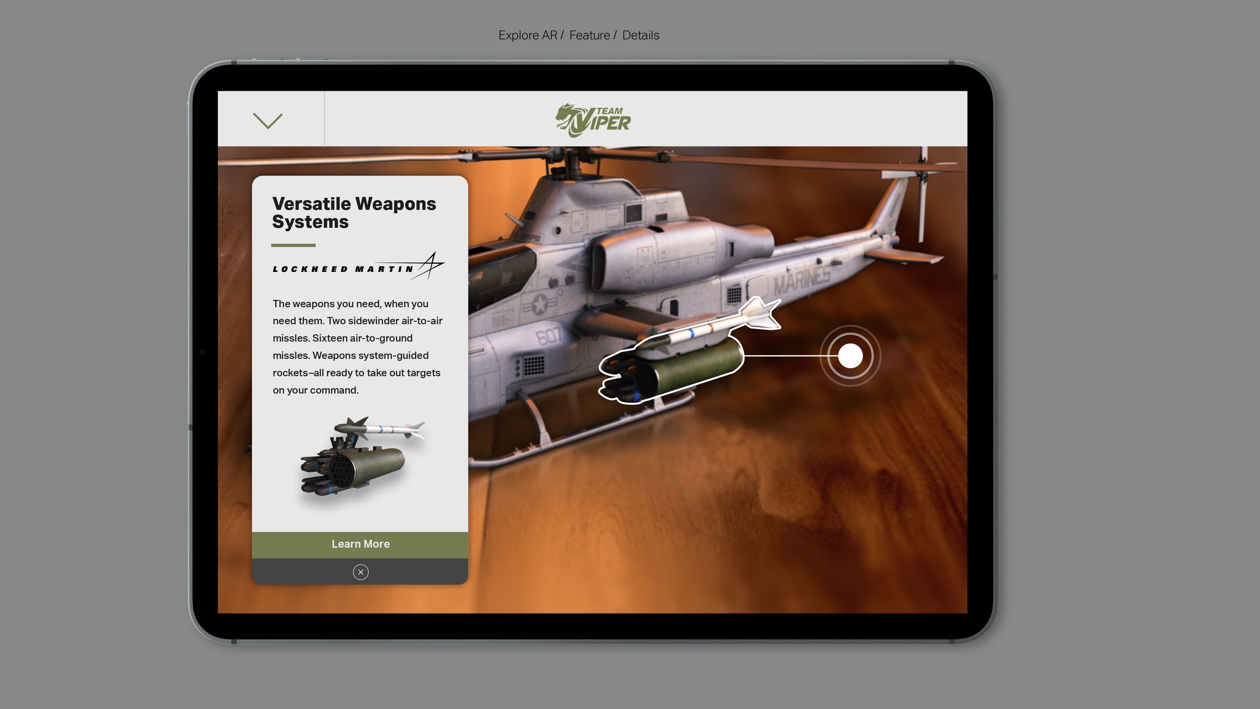 A tablet screen displays an interaction with a 3D model of a military helicopter, showcasing its weapon systems from Team Viper, including air-to-air and air-to-ground missiles, with descriptions and a "Learn More" button.