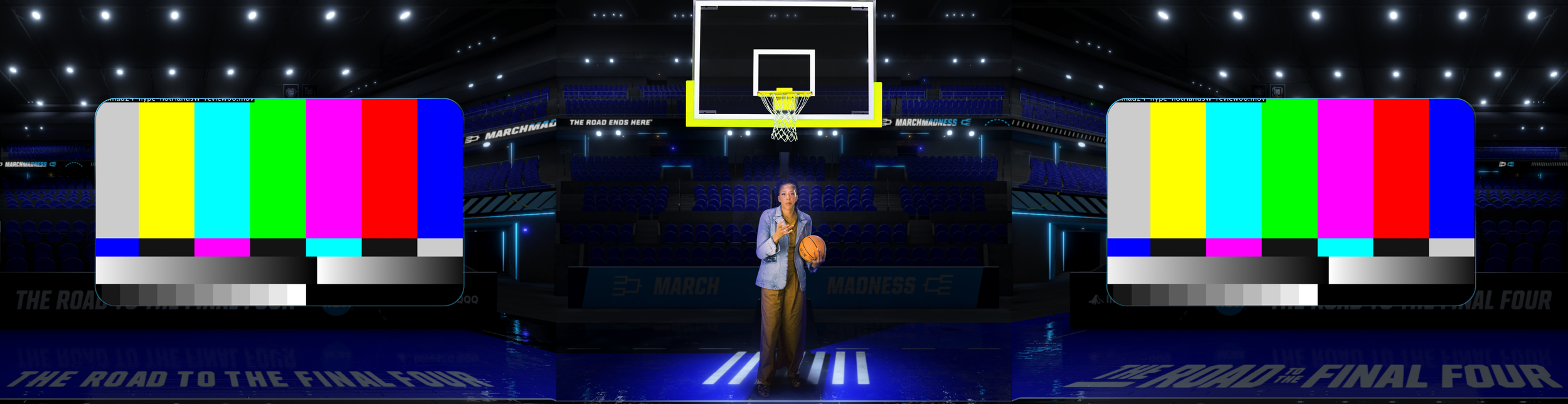 A woman stands on a basketball court holding a basketball and talking on her phone inside an arena. The arena is dimly lit with blue lighting and banners that say "MARCH MADNESS" and "THE ROAD TO THE FINAL FOUR." There are large screens with color ba