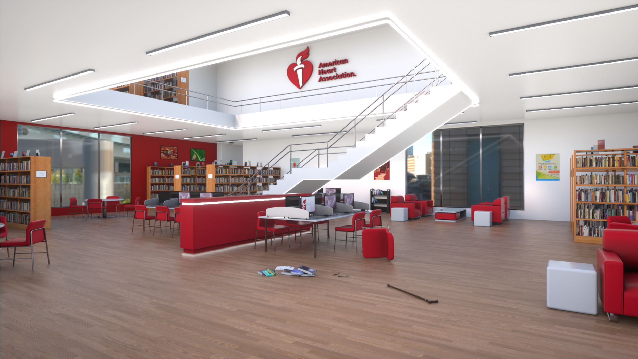 Library workspace with red chairs, bookshelves, a computer area, and a staircase with an American Heart Association logo overhead.