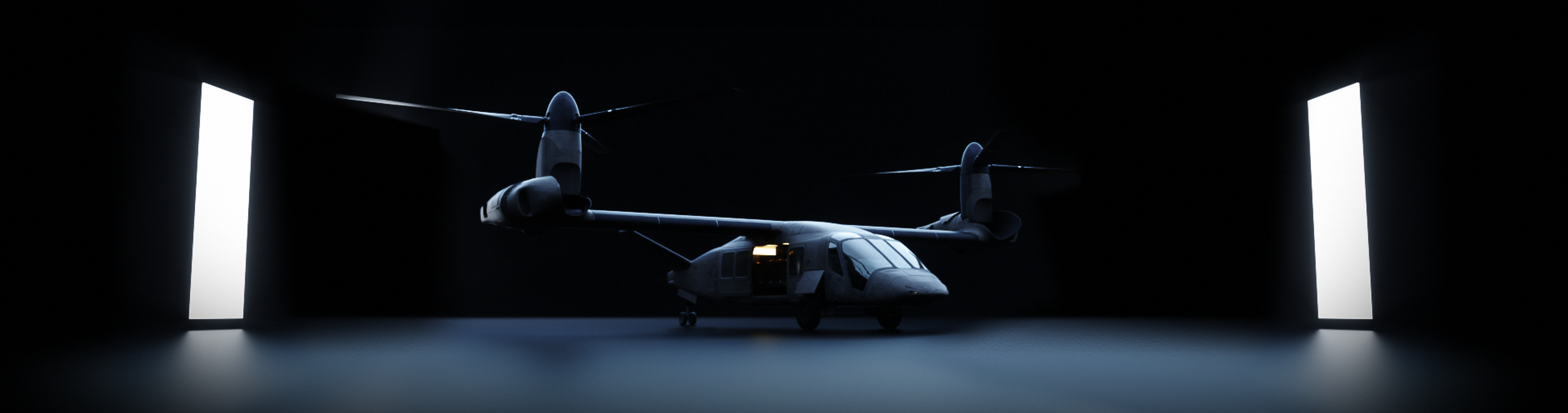 A military tiltrotor aircraft inside a dark hangar with bright lights on each side.