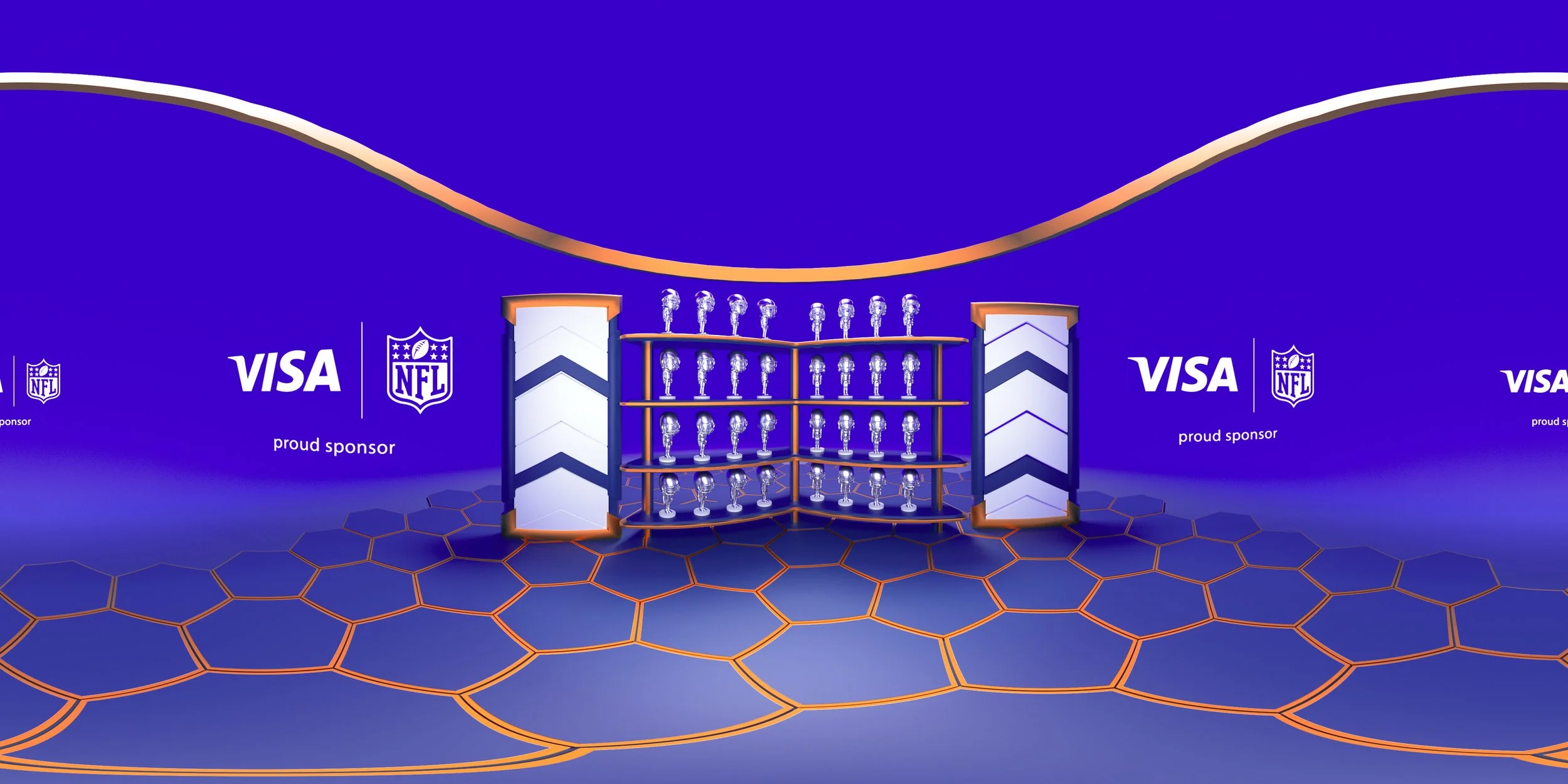 A stage with multiple silver trophies or awards on orange and blue shelves, set against a blue background with NFL and Visa logos and the text 'proud sponsor.' The stage is framed by two vertical columns and the floor has a honeycomb pattern.