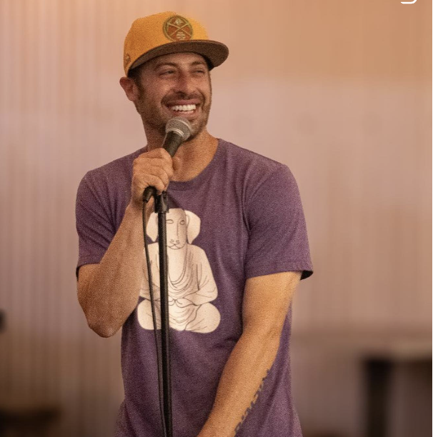 Brian Blank talking into a mic