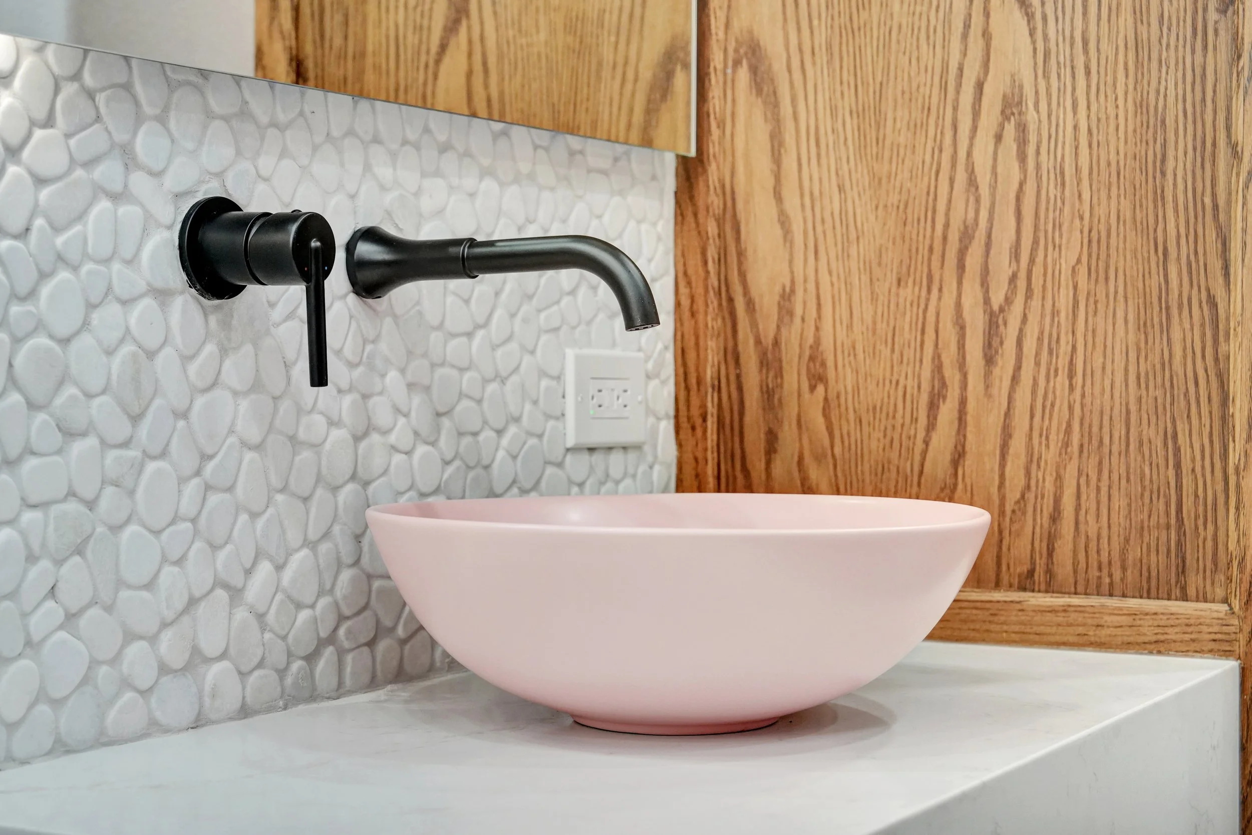 Castor Residence primary bathroom remodel in Midland, Texas, featuring custom floating vanities, a freestanding tub, and a frameless glass shower.