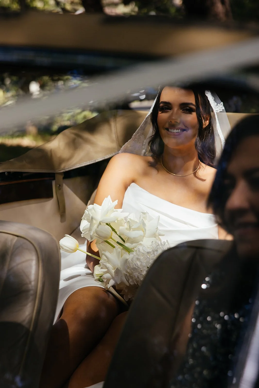 Bride in wedding convertible.jpg