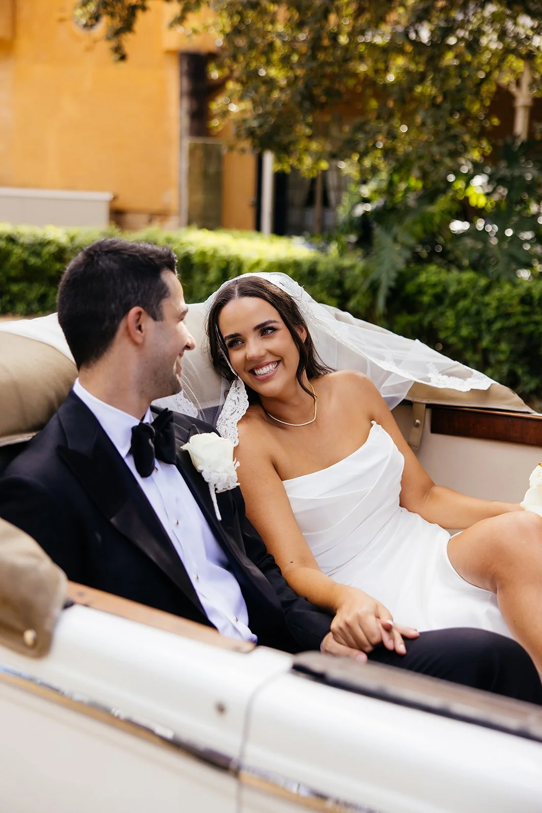 Couple in wedding convertible.jpg