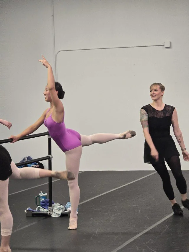 Maddy Werner encouraging a BalletCorps student during class
