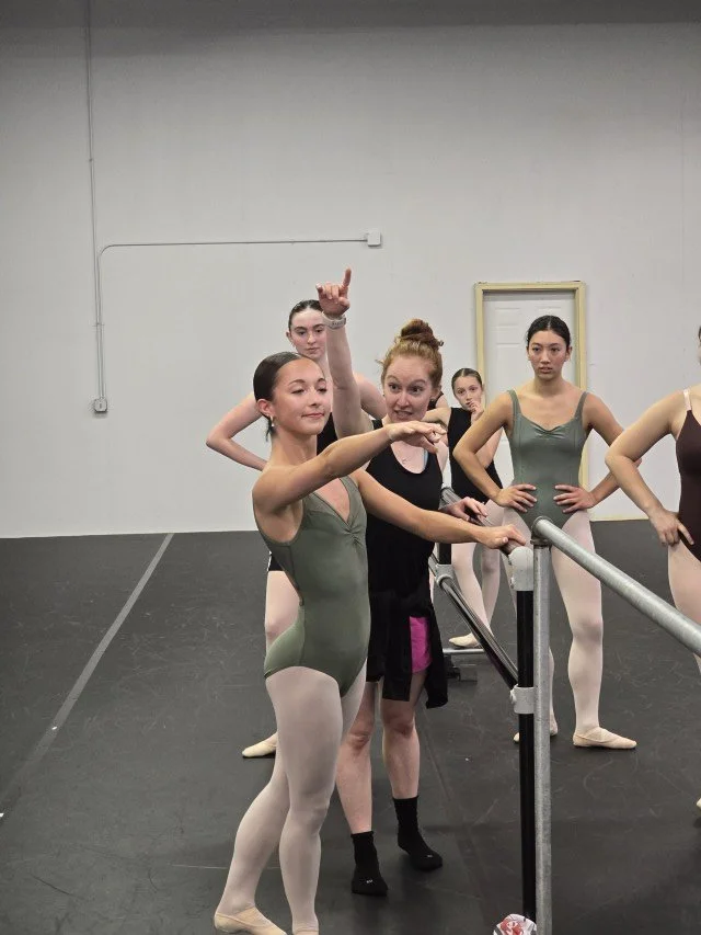 Megan Lynch refining a BalletCorps student’s focus and line