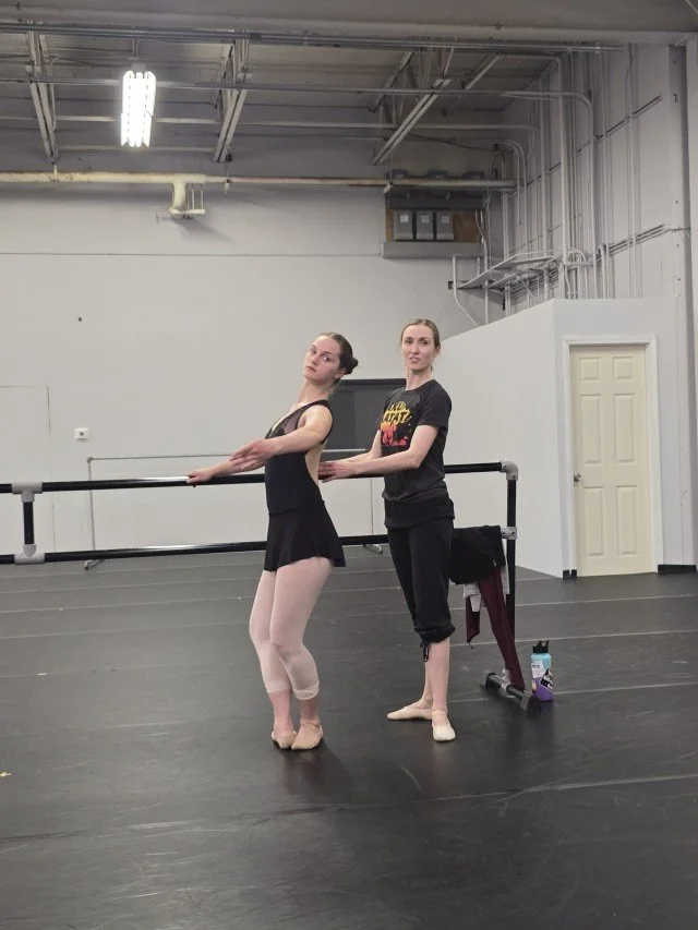 Kimberly Uphoff Spencer working one-on-one with a BalletCorps student