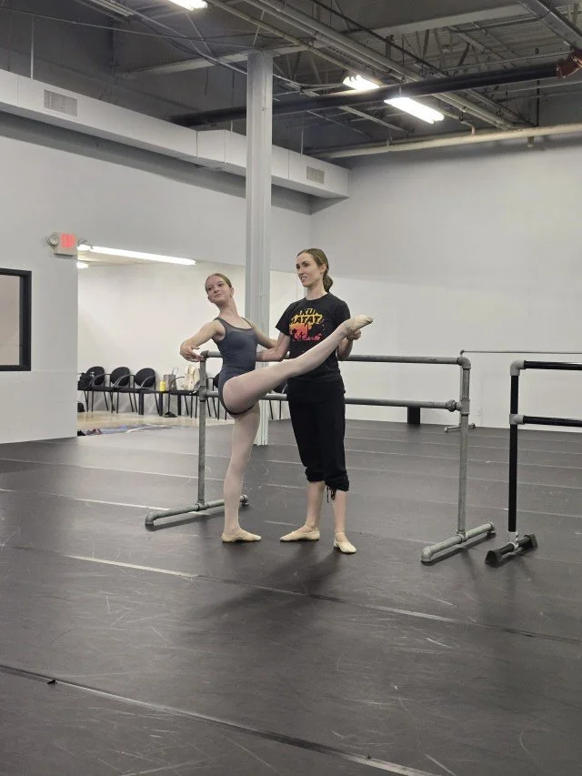 Kimberly Uphoff Spencer coaching a BalletCorps student through placement and extension