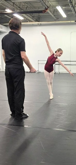 Logan Pachciarz working one-on-one with a BalletCorps student
