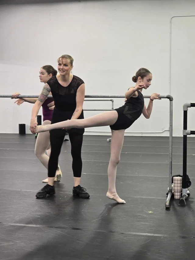 Maddy Werner working directly with a BalletCorps student