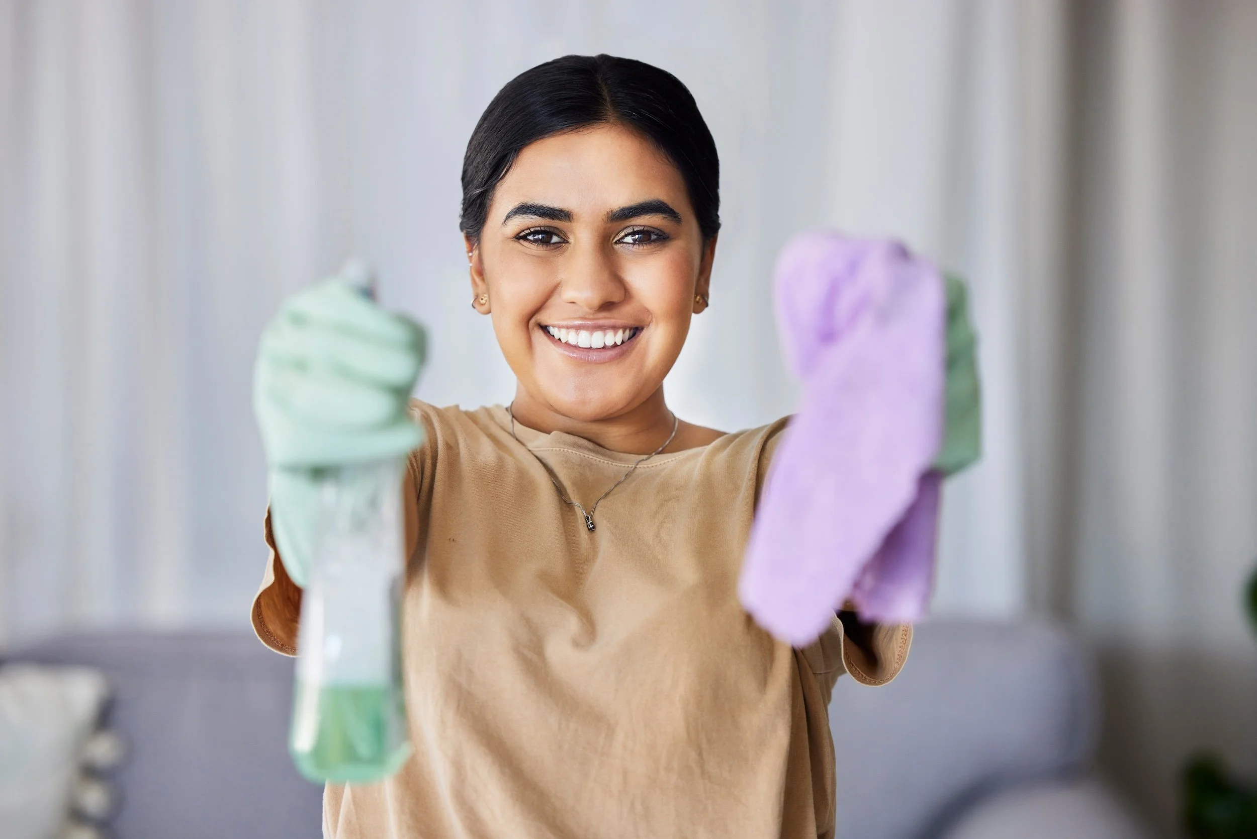 woman-portrait-and-cleaning-with-product-cloth-a-2023-11-27-05-28-06-utc.jpg