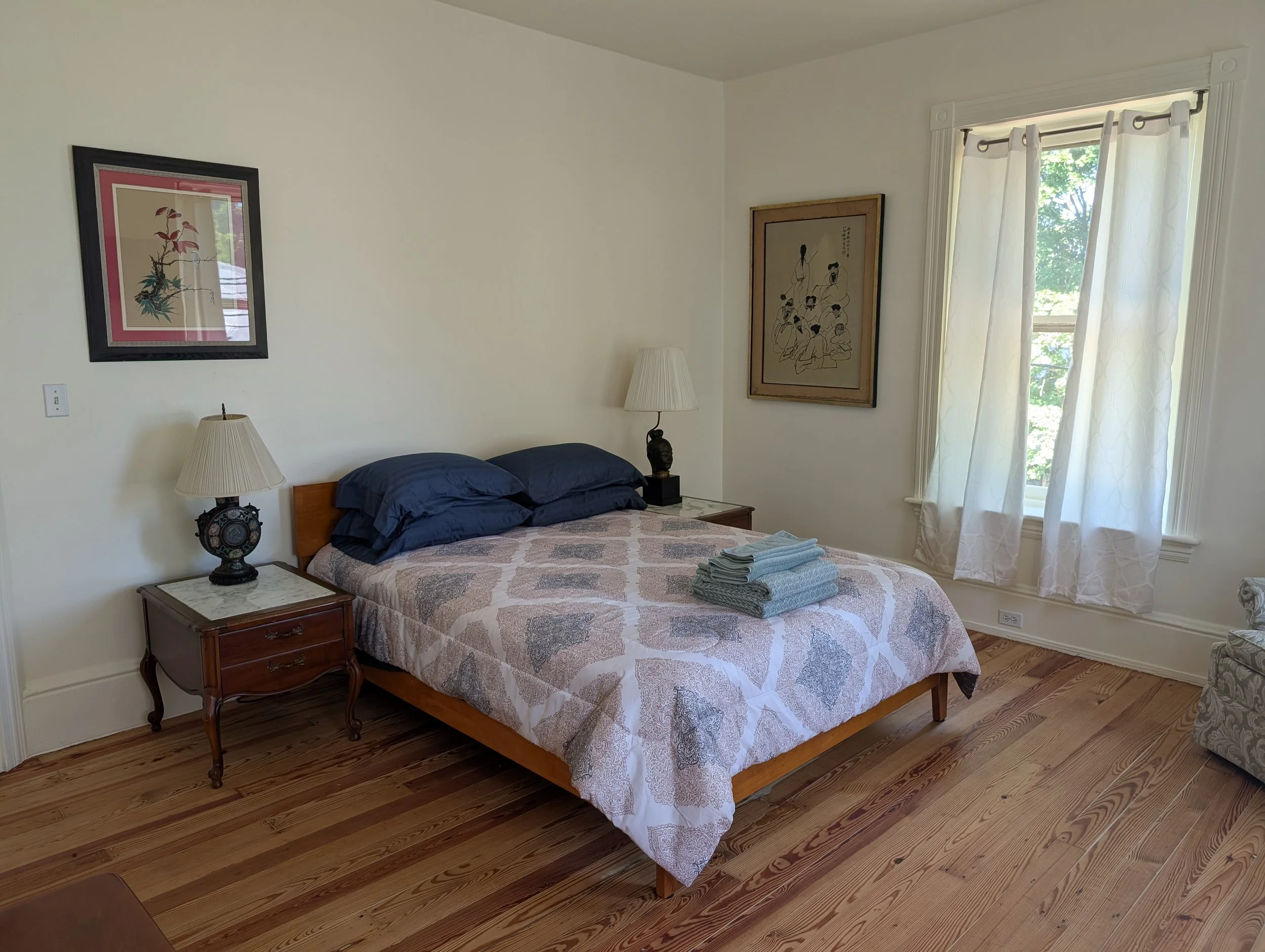Northwest Room at Bella Vista Bed and Breakfast featuring a queen bed, restored hardwood floors, and peaceful views in Akron, Pennsylvania.
