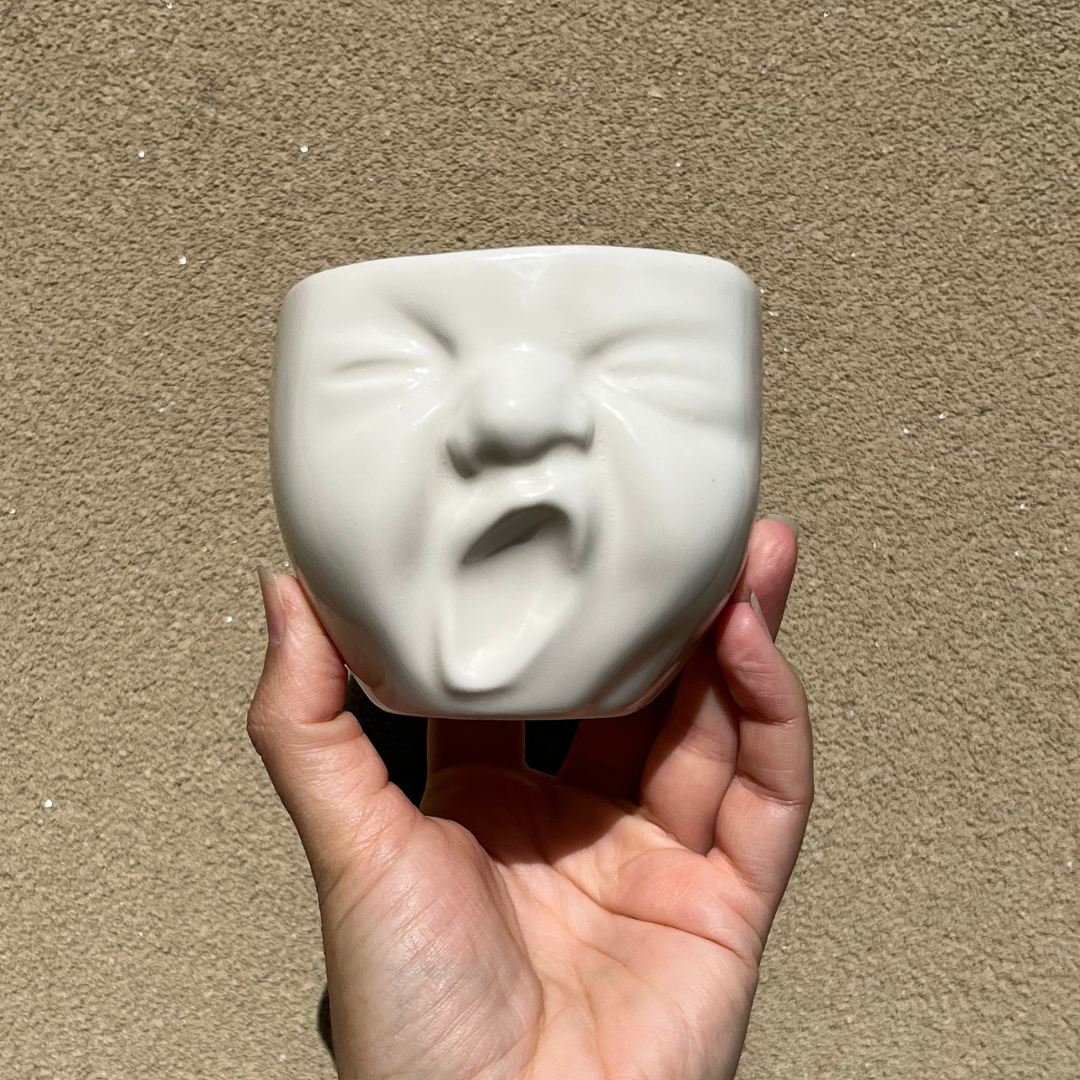 White Ceramic Yawning Baby Pot (7).png